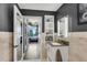 Bright bathroom with a double vanity and city view at 860 Peachtree Ne St # 2513, Atlanta, GA 30308