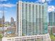 High rise building in an urban setting with balconies and a rooftop pool at 860 Peachtree Ne St # 2513, Atlanta, GA 30308