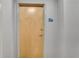 Light-colored wood door in building hallway at 860 Peachtree Ne St # 2513, Atlanta, GA 30308