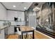 Modern kitchen with stainless steel appliances and city mural at 860 Peachtree Ne St # 2513, Atlanta, GA 30308