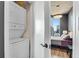 Stackable washer and dryer in a small laundry closet at 860 Peachtree Ne St # 2513, Atlanta, GA 30308