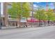 Street-level storefronts showcasing various businesses in a city setting at 860 Peachtree Ne St # 2513, Atlanta, GA 30308
