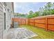 Small backyard with wooden fence and patio at 7628 Squire Court, Fairburn, GA 30213