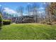 Large backyard with grassy area and mature trees at 5916 Downington Nw Pl, Acworth, GA 30101