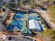 Aerial view of community tennis courts, clubhouse, and pool at 5916 Downington Nw Pl, Acworth, GA 30101