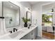 Double vanity bathroom with a frameless glass shower and modern fixtures at 105 Georgia Se Ave # 2, Atlanta, GA 30312