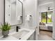 Stylish bathroom with floating vanity, sleek mirror, and view of bedroom at 105 Georgia Se Ave # 2, Atlanta, GA 30312