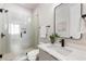 Modern bathroom with glass shower, floating vanity, and black accents at 105 Georgia Se Ave # 2, Atlanta, GA 30312