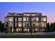 Modern multi-unit building with lighted windows at dusk at 105 Georgia Se Ave # 2, Atlanta, GA 30312