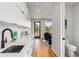 Modern kitchen with white cabinets and a view of the balcony at 105 Georgia Se Ave # 2, Atlanta, GA 30312