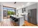 Modern kitchen with island, quartz countertops, and stainless steel appliances at 105 Georgia Se Ave # 2, Atlanta, GA 30312