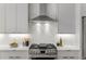 Stainless steel range and range hood in modern kitchen at 105 Georgia Se Ave # 2, Atlanta, GA 30312