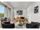 Modern living room with a mustard sofa and city view at 105 Georgia Se Ave # 2, Atlanta, GA 30312