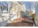 Home features a small deck, partially covered, in the backyard at 320 Harden Se St, Atlanta, GA 30312
