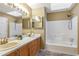 Bathroom with double sinks, bathtub, and shower at 320 Harden Se St, Atlanta, GA 30312