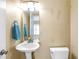 Small half bathroom with pedestal sink and toilet at 320 Harden Se St, Atlanta, GA 30312