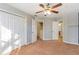 Bedroom with double door closet and ceiling fan at 320 Harden Se St, Atlanta, GA 30312