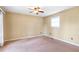 Bright bedroom with carpet flooring and ceiling fan at 320 Harden Se St, Atlanta, GA 30312