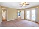 Spacious bedroom with ceiling fan and access to balcony at 320 Harden Se St, Atlanta, GA 30312