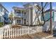 Tan two-story house with white picket fence and balcony at 320 Harden Se St, Atlanta, GA 30312