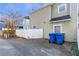 Rear view of house with driveway, yard, and trash bins at 320 Harden Se St, Atlanta, GA 30312