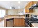 Efficient kitchen with stainless steel appliances and wood cabinetry at 320 Harden Se St, Atlanta, GA 30312