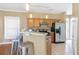 Modern kitchen with stainless steel appliances and wood cabinets at 320 Harden Se St, Atlanta, GA 30312