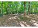 Large backyard with fire pit and wooded area at 3875 Shiloh Trail West Nw, Kennesaw, GA 30144