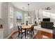 Kitchen breakfast area with round table and chairs, overlooking living room at 449 Highlands Loop, Woodstock, GA 30188