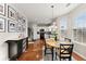 Bright kitchen with white cabinets, hardwood floors, and an island at 449 Highlands Loop, Woodstock, GA 30188