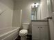 Small bathroom with single vanity, tub shower combo at 144 Paces Overlook Trce, Dallas, GA 30157