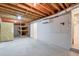 Unfinished basement with exposed beams and ample storage at 1499 Justin Dr, Lawrenceville, GA 30043