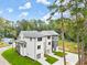 Aerial view of three new construction townhouses with attached garages and landscaped yards at 1695 Thomas St, Decatur, GA 30032