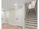 Unfinished basement with stairs and storage at 1695 Thomas St, Decatur, GA 30032