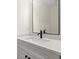 Vanity with quartz countertop and black faucet at 1695 Thomas St, Decatur, GA 30032