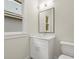 Modern bathroom with white vanity and a mirror at 1695 Thomas St, Decatur, GA 30032