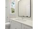 Modern bathroom with white vanity and quartz countertop at 1695 Thomas St, Decatur, GA 30032