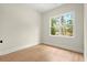Bright bedroom featuring hardwood floors and a large window at 1695 Thomas St, Decatur, GA 30032