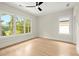 Bedroom with hardwood floors, ceiling fan and large windows at 1695 Thomas St, Decatur, GA 30032