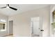 Bedroom with hardwood floors, ceiling fan and access to bathroom at 1695 Thomas St, Decatur, GA 30032