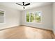 Bedroom with hardwood floors, ceiling fan and large windows at 1695 Thomas St, Decatur, GA 30032