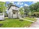 New construction home with a spacious front porch and yard at 1695 Thomas St, Decatur, GA 30032