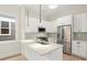 Modern kitchen with white cabinets, stainless steel appliances, and quartz countertops at 1695 Thomas St, Decatur, GA 30032