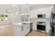 Open concept kitchen with island and stainless steel appliances at 1695 Thomas St, Decatur, GA 30032