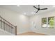 Bright living room featuring hardwood floors and a ceiling fan at 1695 Thomas St, Decatur, GA 30032