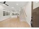 Bright living room with hardwood floors and open staircase at 1695 Thomas St, Decatur, GA 30032