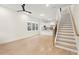Open concept living area with hardwood floors and kitchen view at 1695 Thomas St, Decatur, GA 30032