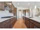 Modern kitchen with dark cabinetry, quartz countertops, and stainless steel appliances at 784 Keystone Dr, Woodstock, GA 30188