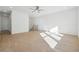 Spacious loft area with hardwood floors and a ceiling fan at 784 Keystone Dr, Woodstock, GA 30188