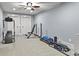 Basement home gym with treadmill, weights, and mats at 9550 Rod Rd, Johns Creek, GA 30022